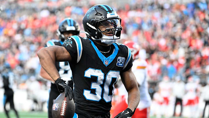 Nov 24, 2024; Charlotte, North Carolina, USA; Carolina Panthers running back Chuba Hubbard (30) with the ball after scoring a touchdown in the fourth quarter at Bank of America Stadium. Mandatory Credit: Bob Donnan-Imagn Images