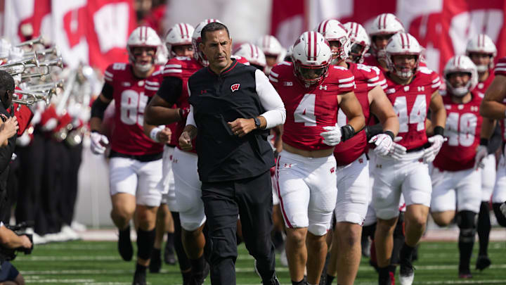 Sep 20, 2025; Madison, Wisconsin, USA;  Wisconsin Badgers head coach Luke Fickell runs onto the field ahead of players prior to the game against the Maryland Terrapins at Camp Randall Stadium. Mandatory Credit: Jeff Hanisch-Imagn Images