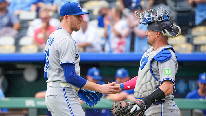 Sep 21, 2025; Kansas City, Missouri, USA; Toronto Blue Jays relief pitcher Jeff Hoffman (23) celebrates with catcher Tyler Heineman (55) after the win over the Kansas City Royals at Kauffman Stadium
