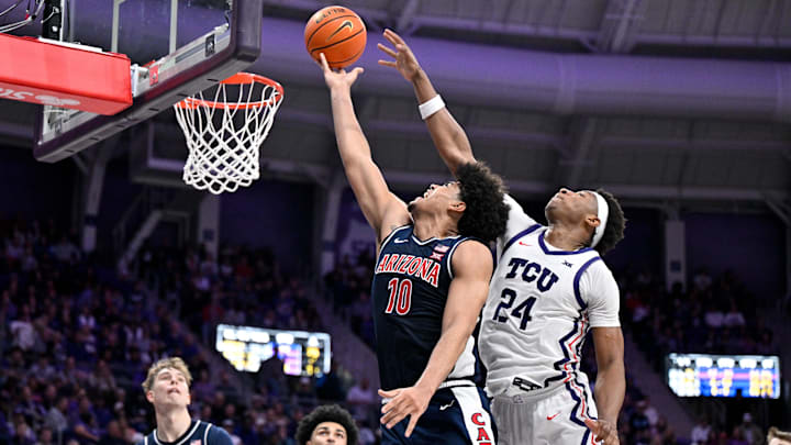 Jan 10, 2026; Fort Worth, Texas, USA; Arizona Wildcats forward Koa Peat (10) drives to the basket past TCU Horned Frogs forward Xavier Edmonds (24) during the second half at the Ed and Rae Schollmaier Arena. Mandatory Credit: Jerome Miron-Imagn Images