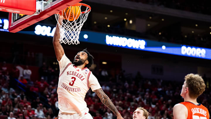 Jan 30, 2025; Lincoln, Nebraska, USA; Nebraska Cornhuskers guard Brice Williams (3) dunks the ball against Illinois Fighting Illini forward Jake Davis (15) and guard Kasparas Jakucionis (32) during the first half at Pinnacle Bank Arena.