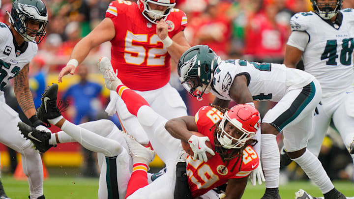 Sep 14, 2025; Kansas City, Missouri, USA; Kansas City Chiefs running back Kareem Hunt (29) is tackled by the Philadelphia Eagles during the second quarter of the game at GEHA Field at Arrowhead Stadium. Mandatory Credit: Jay Biggerstaff-Imagn Images