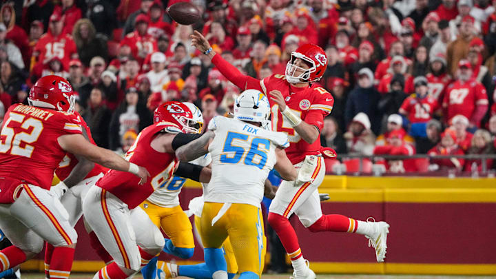 Dec 8, 2024; Kansas City, Missouri, USA; Kansas City Chiefs quarterback Patrick Mahomes (15) leaps while passing as Los Angeles Chargers defensive end Morgan Fox (56) defends during the second half at GEHA Field at Arrowhead Stadium. Mandatory Credit: Denny Medley-Imagn Images Dec 8, 2024; Kansas City, Missouri, USA; Kansas City Chiefs quarterback Patrick Mahomes (15) leaps while passing as Los Angeles Chargers defensive end Morgan Fox (56) defends during the second half at GEHA Field at Arrowhead Stadium. Mandatory Credit: Denny Medley-Imagn Images