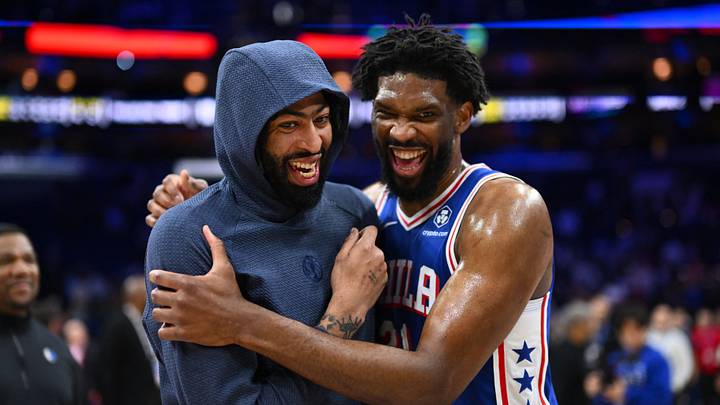 Dallas Mavericks forward Anthony Davis (3) reacts with Philadelphia 76ers center Joel Embiid (21) after the game at Wells Fargo Center. 