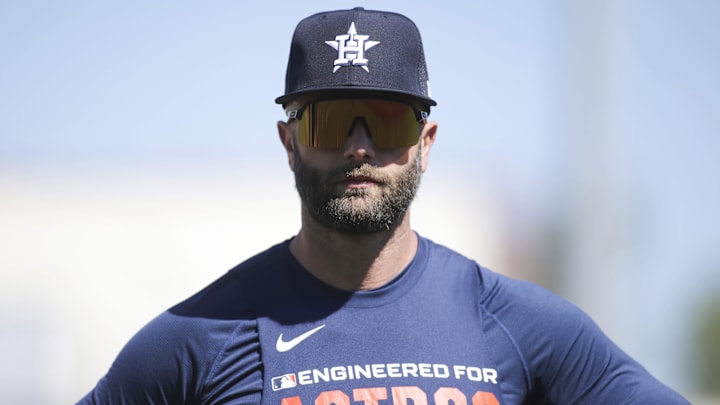 Christian Walker looks on. 
