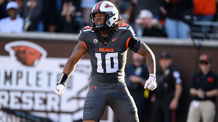 Sep 21, 2024; Corvallis, Oregon, USA; Oregon State Beavers linebacker Zakaih Saez (10) intercepts a pass for a touchdown during the first quarter against the Purdue Boilermakers at Reser Stadium. Mandatory Credit: Craig Strobeck-Imagn Images