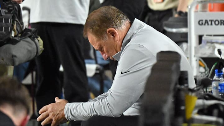 Michigan State men's basketball coach Tom Izzo takes a moment along the MSU bench before the start of the Superior Dome Showdown against NMU on Sunday, Oct. 13.