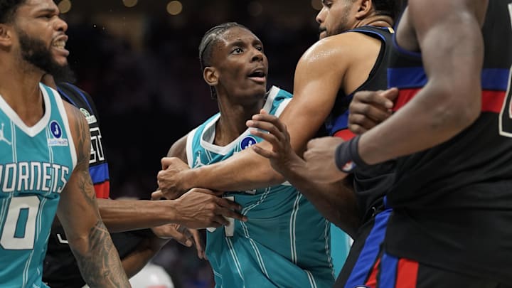 Feb 9, 2026; Charlotte, North Carolina, USA;  Charlotte Hornets forward Moussa Diabaté (14) and forward Miles Bridges (0) are ejected after a fight with Detroit Pistons center Jalen Duren (0) and forward/center Isaiah Stewart (28) during the second half at Spectrum Center. Mandatory Credit: Jim Dedmon-Imagn Images