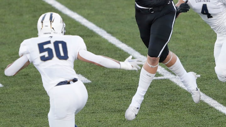 Fond du Lac High School's Max Mengel (1) pulls down a first down reception against Appleton North High School's Ben Wenzel (50) and Bobby Salm (4) during their football game Thursday, August 31, 2023, in Fond du Lac, Wis. 
Dan Powers/USA TODAY NETWORK-Wisconsin.