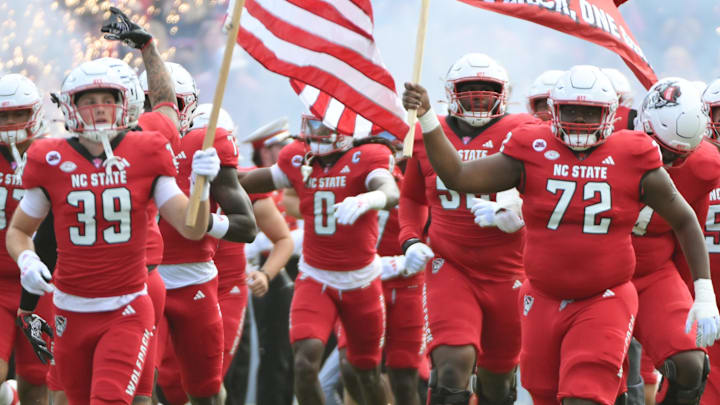 Nov 2, 2024; Raleigh, North Carolina, USA; North Carolina State Wolfpack football team takes the field against the Stanford Cardinals at Carter-Finley Stadium. Mandatory Credit: Zachary Taft-Imagn Images Nov 2, 2024; Raleigh, North Carolina, USA; North Carolina State Wolfpack football team takes the field against the Stanford Cardinals at Carter-Finley Stadium. Mandatory Credit: Zachary Taft-Imagn Images