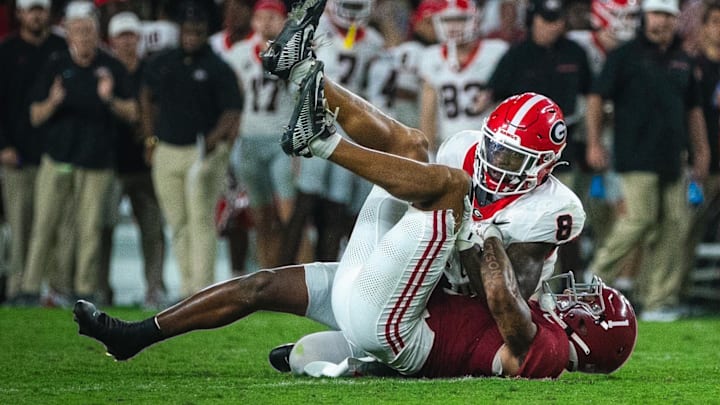 Sep 28, 2024; Tuscaloosa, Alabama, USA; Alabama Crimson Tide defensive back Domani Jackson (1) brings down Georgia Bulldogs wide receiver Colbie Young (8) during the fourth quarter at Bryant-Denny Stadium. Sep 28, 2024; Tuscaloosa, Alabama, USA; Alabama Crimson Tide defensive back Domani Jackson (1) brings down Georgia Bulldogs wide receiver Colbie Young (8) during the fourth quarter at Bryant-Denny Stadium.