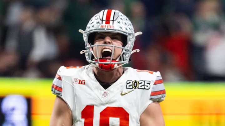 Jan 20, 2025; Atlanta, GA, USA; Ohio State Buckeyes quarterback Will Howard (18) celebrates a touchdown against the Notre Dame Fighting Irish during the CFP National Championship college football game at Mercedes-Benz Stadium. Mandatory Credit: Mark J. Rebilas-Imagn Images