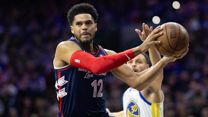 Feb 7, 2024; Philadelphia, Pennsylvania, USA; Philadelphia 76ers forward Tobias Harris (12) drives for a shot past Golden State Warriors guard Stephen Curry (30) during the first quarter at Wells Fargo Center. Mandatory Credit: Bill Streicher-Imagn Images