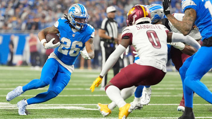 Detroit Lions running back Jahmyr Gibbs (26) runs the ball in the first quarter against the Washington Commanders in the NFC divisional round at Ford Field in Detroit on Saturday, Jan. 18, 2025.