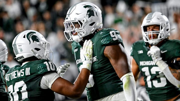 Michigan State's Jalen Thompson, right, celebrates his tackle for a safety against Western Michigan during the third quarter on Friday, Aug. 29, 2025, in East Lansing.