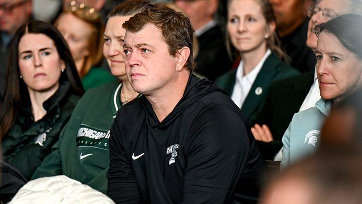 Michigan State hockey coach Adam Nightingale listens during new football coach Pat Fitzgerald's introductory press conference on Tuesday, Dec. 2, 2025, at the Tom Izzo Football Building in East Lansing.