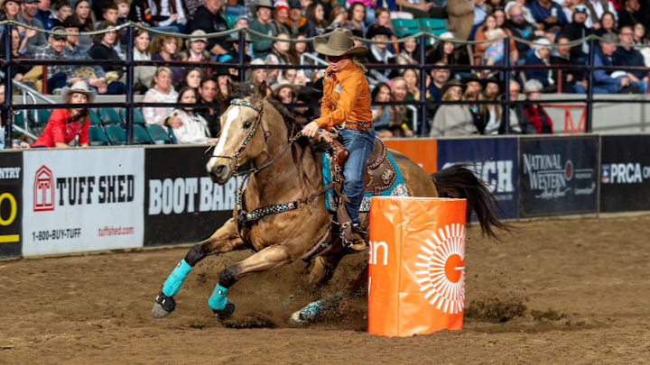 Riding her great mare Bucky Wonder Horse, “Bee,” Shelley Morgan won the barrel racing in Bracket 8 at the National Western Stock Show Rodeo. She and Bee stopped the clock in 14.74 seconds during the matinee performance, then came back Friday night with a 14.70. Her total of 29.44 has her coming back to Saturday’s Semi-Finals hoping for more success and an advancement to Sunday’s Championship Finals. 