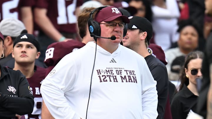 Dec 20, 2025; College Station, TX, USA; Texas A&M Aggies head coach Mike Elko reacts during the first quarter during the first round of the CFP National Playoff against the Miami Hurricanes at Kyle Field. Mandatory Credit: Maria Lysaker-Imagn Images