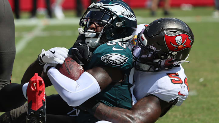 Sep 29, 2024; Tampa, Florida, USA; Tampa Bay Buccaneers linebacker Lavonte David (54) tackles Philadelphia Eagles wide receiver Parris Campbell (80) during the first half at Raymond James Stadium. 