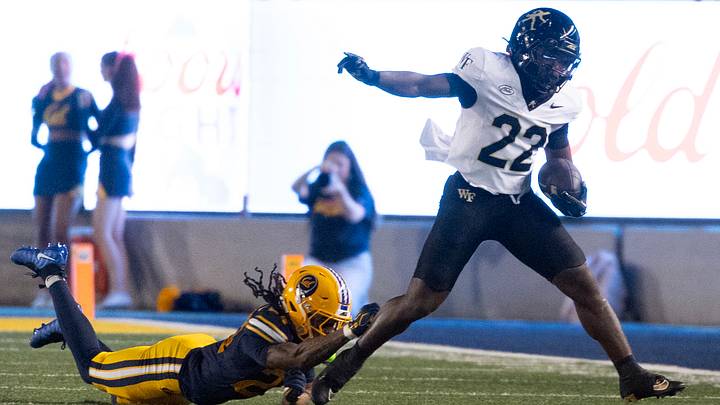 Oct 17, 2026; Berkeley, California, USA; Wake Forest Demon Deacons returner Deuce Lawrence (22) eludes the tackle of California Golden Bears defensive back Quimari Shemwell (24) on a punt return during the first quarter at California Memorial Stadium. Mandatory Credit: D. Ross Cameron-Imagn Images Oct 17, 2026; Berkeley, California, USA; Wake Forest Demon Deacons returner Deuce Lawrence (22) eludes the tackle of California Golden Bears defensive back Quimari Shemwell (24) on a punt return during the first quarter at California Memorial Stadium. Mandatory Credit: D. Ross Cameron-Imagn Images