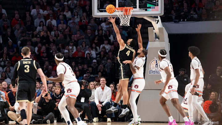 Purdue Boilermakers forward Trey Kaufman-Renn (4) goes up for a layup on Auburn Tigers forward Johni Broome (4) as Auburn Tigers take on Purdue Boilermakers at Legacy Arena in Birmingham, Ala., on Saturday, Dec. 21, 2024.