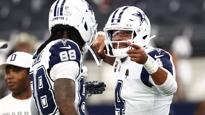 Dallas Cowboys stars Dak Prescott and Ceedee Lamb celebrate a touchdown against the Washington Commanders 