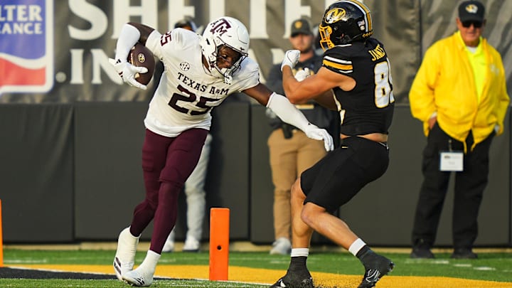 Nov 8, 2025; Columbia, Missouri, USA; Texas A&M Aggies safety Dalton Brooks (25) returns a fumble against Missouri Tigers tight end Jude James (89) during the first half at Faurot Field at Memorial Stadium. Mandatory Credit: Jay Biggerstaff-Imagn Images Nov 8, 2025; Columbia, Missouri, USA; Texas A&M Aggies safety Dalton Brooks (25) returns a fumble against Missouri Tigers tight end Jude James (89) during the first half at Faurot Field at Memorial Stadium. Mandatory Credit: Jay Biggerstaff-Imagn Images