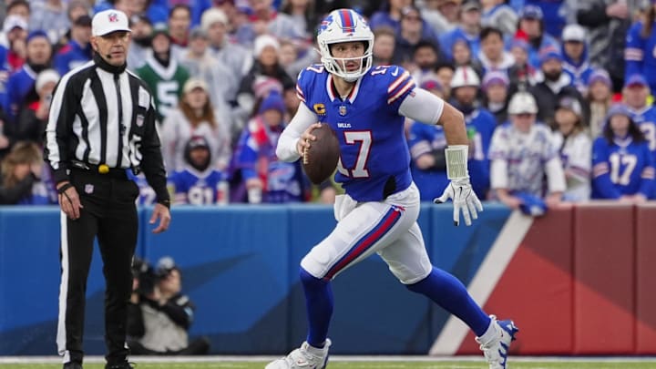 Buffalo Bills quarterback Josh Allen rolls out looking to throw the ball against the New York Jets.