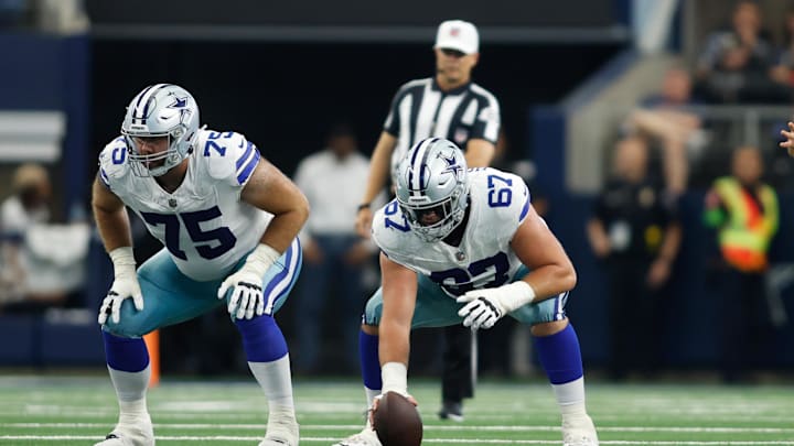 Dallas Cowboys offensive tackle Josh Ball and center Brock Hoffman on the line of scrimmage against the Jacksonville Jaguars