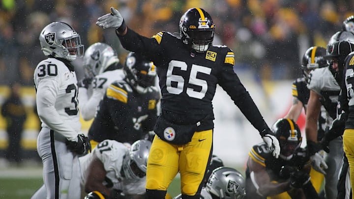 Pittsburgh Steelers Dan Moore Jr. (65) signals for a first down during the first half against the Las Vegas Raiders at Acrisure Stadium in Pittsburgh, PA on December 24, 2022.

Pittsburgh Steelers Vs Las Vegas Raiders Week 16