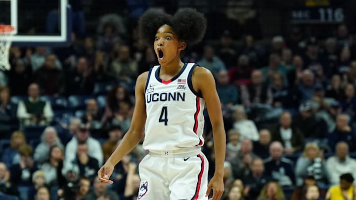 Dec 6, 2023; Storrs, Connecticut, USA; UConn Huskies guard Qadence Samuels (4) reacts after her three point basket against the Ball State Cardinals in the first half at Harry A. Gampel Pavilion. Mandatory Credit: David Butler II-Imagn Images Dec 6, 2023; Storrs, Connecticut, USA; UConn Huskies guard Qadence Samuels (4) reacts after her three point basket against the Ball State Cardinals in the first half at Harry A. Gampel Pavilion. Mandatory Credit: David Butler II-Imagn Images