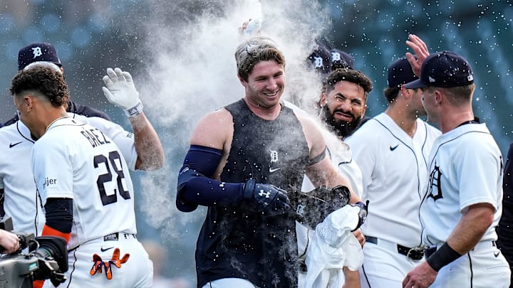 Detroit Tigers second baseman Colt Keith (33), center, is congratulated by teammates after batting a walk-off single against Kansas City Royals to win the game 10-9 at Comerica Park in Detroit on Thursday, April 16, 2026.