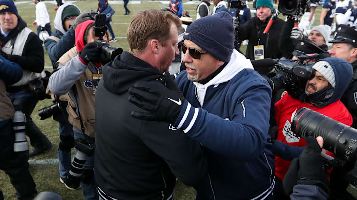 Dec 21, 2024; University Park, Pennsylvania, USA; Penn State Nittany Lions head coach James Franklin (right) meets Southern Methodist Mustangs head coach Rhett Lashlee (left) at midfield following the game in the first round of the College Football Playoff at Beaver Stadium. Mandatory Credit: Matthew O'Haren-Imagn Images Dec 21, 2024; University Park, Pennsylvania, USA; Penn State Nittany Lions head coach James Franklin (right) meets Southern Methodist Mustangs head coach Rhett Lashlee (left) at midfield following the game in the first round of the College Football Playoff at Beaver Stadium. Mandatory Credit: Matthew O'Haren-Imagn Images