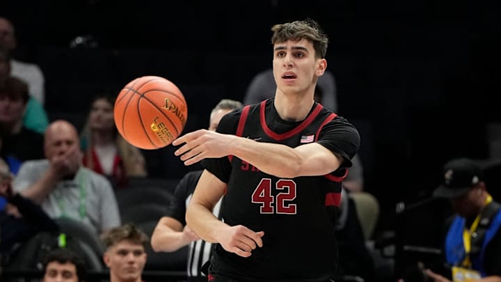 Mar 13, 2025; Charlotte, NC, USA; Stanford Cardinal forward Maxime Raynaud (42) passes the ball in the first half at Spectrum Center. Mandatory Credit: Bob Donnan-Imagn Images Mar 13, 2025; Charlotte, NC, USA; Stanford Cardinal forward Maxime Raynaud (42) passes the ball in the first half at Spectrum Center. Mandatory Credit: Bob Donnan-Imagn Images