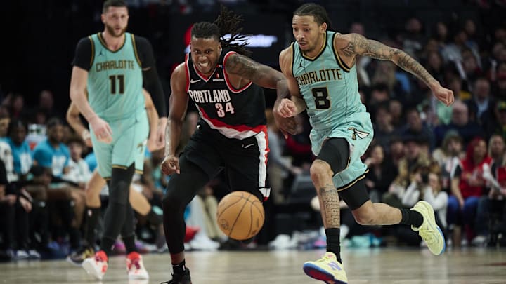 Feb 22, 2025; Portland, Oregon, USA; Portland Trail Blazers forward Jabari Walker (34) and Charlotte Hornets guard Nick Smith Jr. (8) chase down a lose ball during the second half against at Moda Center. Mandatory Credit: Troy Wayrynen-Imagn Images Feb 22, 2025; Portland, Oregon, USA; Portland Trail Blazers forward Jabari Walker (34) and Charlotte Hornets guard Nick Smith Jr. (8) chase down a lose ball during the second half against at Moda Center. Mandatory Credit: Troy Wayrynen-Imagn Images
