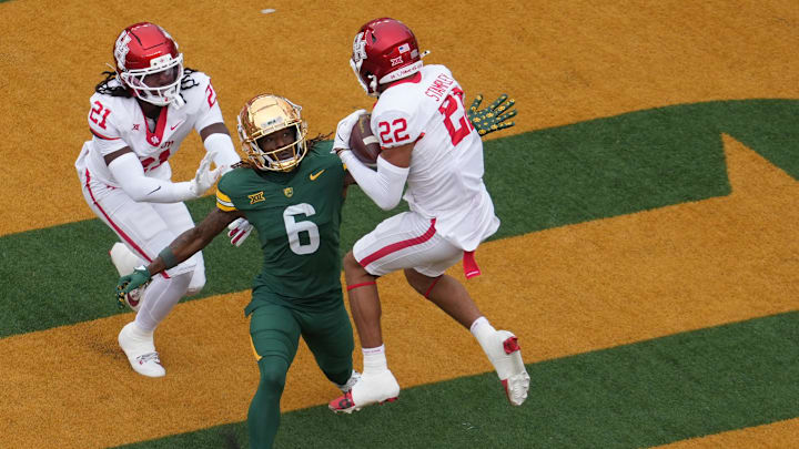 Houston Cougars defensive back Marc Stampley II (22) intercepts a pass intended for Baylor Bears wide receiver Ashtyn Hawkins (6) during the first half at McLane Stadium.