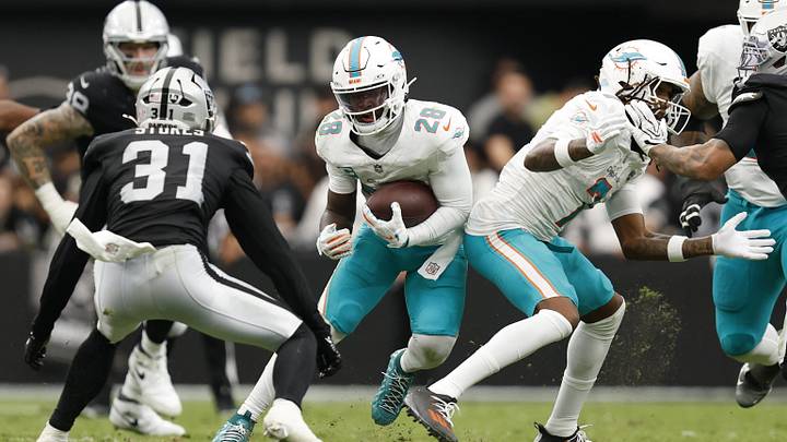 Miami Dolphins running back De'Von Achane (28) runs with the ball in the second quarter against the Las Vegas Raiders at Allegiant Stadium. Miami Dolphins running back De'Von Achane (28) runs with the ball in the second quarter against the Las Vegas Raiders at Allegiant Stadium.