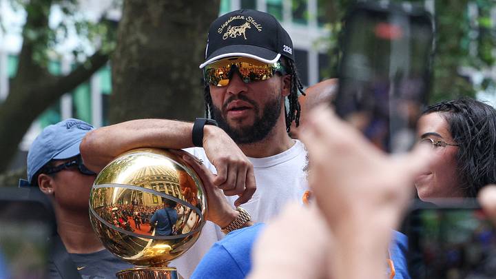 New York Knicks guard Jalen Brunson (11) celebrates while holding the Larry O'Brien Championship Trophy during the Knicks ticker-tape parade and celebration on Broadway in downtown Manhattan. Mandatory Credit: Vincent Carchietta-Imagn Images New York Knicks guard Jalen Brunson (11) celebrates while holding the Larry O'Brien Championship Trophy during the Knicks ticker-tape parade and celebration on Broadway in downtown Manhattan. Mandatory Credit: Vincent Carchietta-Imagn Images