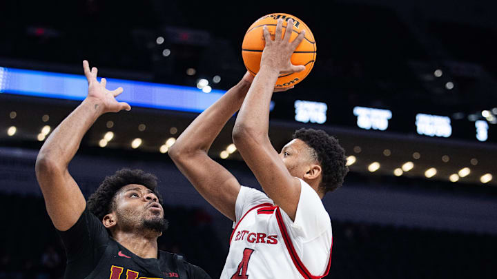 Mar 12, 2025; Indianapolis, IN, USA; Rutgers Scarlet Knights guard Ace Bailey (4) shoots the ball while USC Trojans guard Chibuzo Agbo (7) defends in the second half at Gainbridge Fieldhouse. Mandatory Credit: Trevor Ruszkowski-Imagn Images