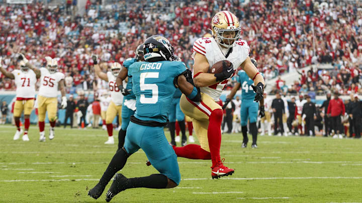 Nov 12, 2023; Jacksonville, Florida, USA; San Francisco 49ers fullback Kyle Juszcyk (44) and Jacksonville Jaguars safety Andre Cisco (5) at EverBank Stadium. Mandatory Credit: Morgan Tencza-USA TODAY Sports