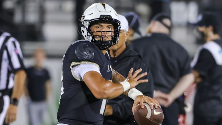 Sep 2, 2021; Orlando, Florida, USA; UCF Knights quarterback Dillon Gabriel (11) warms up before the game against the Boise State Broncos at Bounce House. Mandatory Credit: Mike Watters-Imagn Images