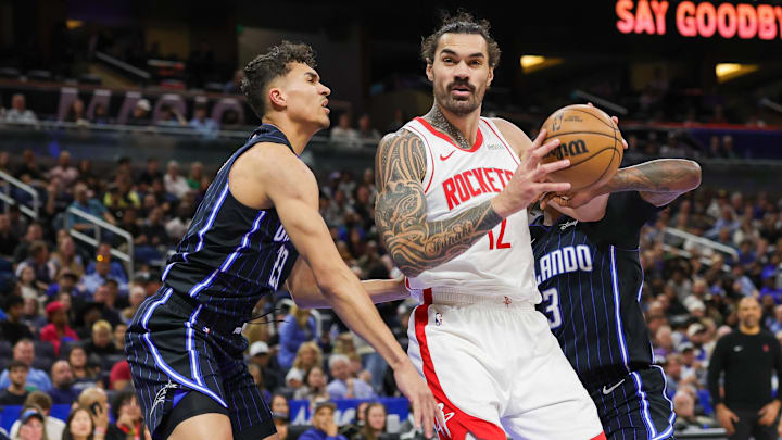 Mar 19, 2025; Orlando, Florida, USA; Orlando Magic forward Tristan da Silva (23) defends Houston Rockets center Steven Adams (12) during the second half at Kia Center. Mandatory Credit: Mike Watters-Imagn Images