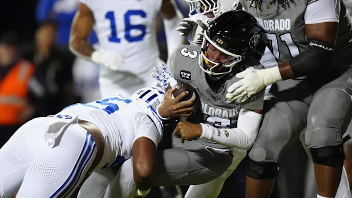 Sep 27, 2025; Boulder, Colorado, USA; Colorado Buffaloes quarterback Kaidon Salter (3) scores a touchdown past Brigham Young Cougars defensive end Viliami Po'uha (45) in the first quarter at Folsom Field. Mandatory Credit: Ron Chenoy-Imagn Images