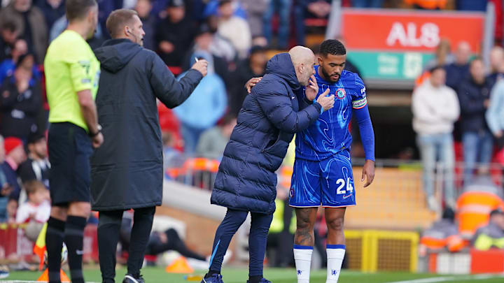 Enzo Maresca (centre right) and Reece James (right) speaking on the touchline.