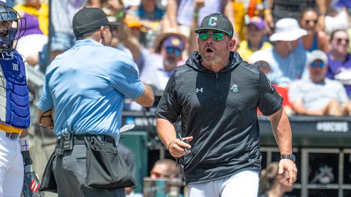 Jun 22, 2025; Omaha, Neb, USA;  Coastal Carolina Chanticleers head coach Kevin Schnall (9) gets thrown out of the game arguing with the umpires during the game against the LSU Tigers during the first inning at Charles Schwab Field. Mandatory Credit: Steven Branscombe-Imagn Images