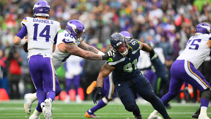 Dec 22, 2024; Seattle, Washington, USA; Minnesota Vikings guard Dalton Risner (66) blocks Seattle Seahawks defensive tackle Byron Murphy II (91) during the first half at Lumen Field. 