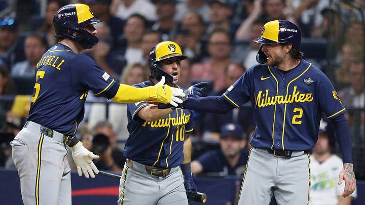 Oct 26, 2026; St. Petersburg, Florida, USA;  Milwaukee Brewers outfielder Garrett Mitchell (5) celebrates with outfielder Sal Frelick (10) and second baseman Brice Turang (2) during the fifth inning against the Tampa Bay Rays in game three of the 2026 World Series at Tropicana Field.  Mandatory Credit: Nathan Ray Seebeck-Imagn Images