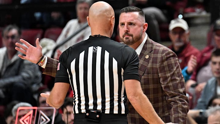 Feb 24, 2026; Tallahassee, Florida, USA; Florida State Seminoles head coach Luke Loucks exchanges words with a referee during the first half against the Miami Hurricanes at Donald L. Tucker Center. Mandatory Credit: Melina Myers-Imagn Images