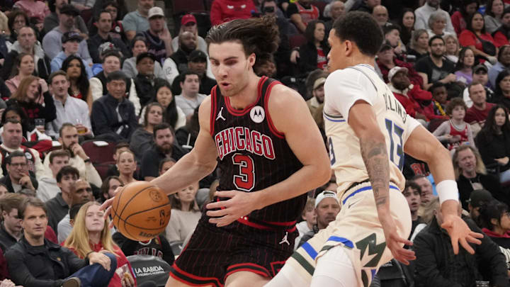 Dec 27, 2025; Chicago, Illinois, USA; Milwaukee Bucks guard Ryan Rollins (13) defends Chicago Bulls guard Josh Giddey (3) during the first half at United Center. Mandatory Credit: David Banks-Imagn Images