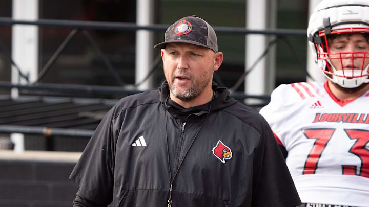 University of Louisville offensive line coach Richard Owens runs a drill during their second practice on Friday, Aug. 2, 2024 at L&N Federal Credit Union Stadium. University of Louisville offensive line coach Richard Owens runs a drill during their second practice on Friday, Aug. 2, 2024 at L&N Federal Credit Union Stadium.